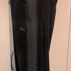 Black and grey velour Puma track pants, size medium.